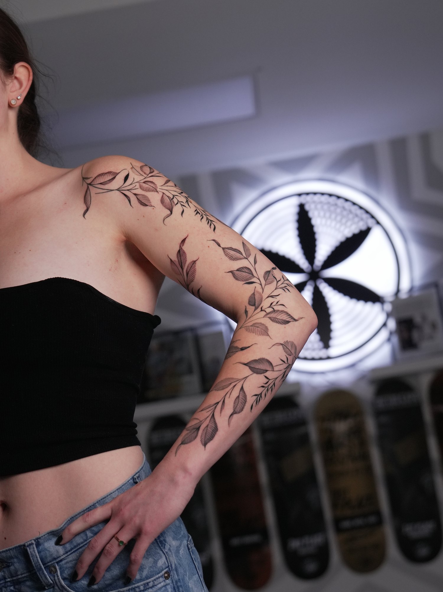 Fine line foliage and trailing vine half sleeve in black and grey