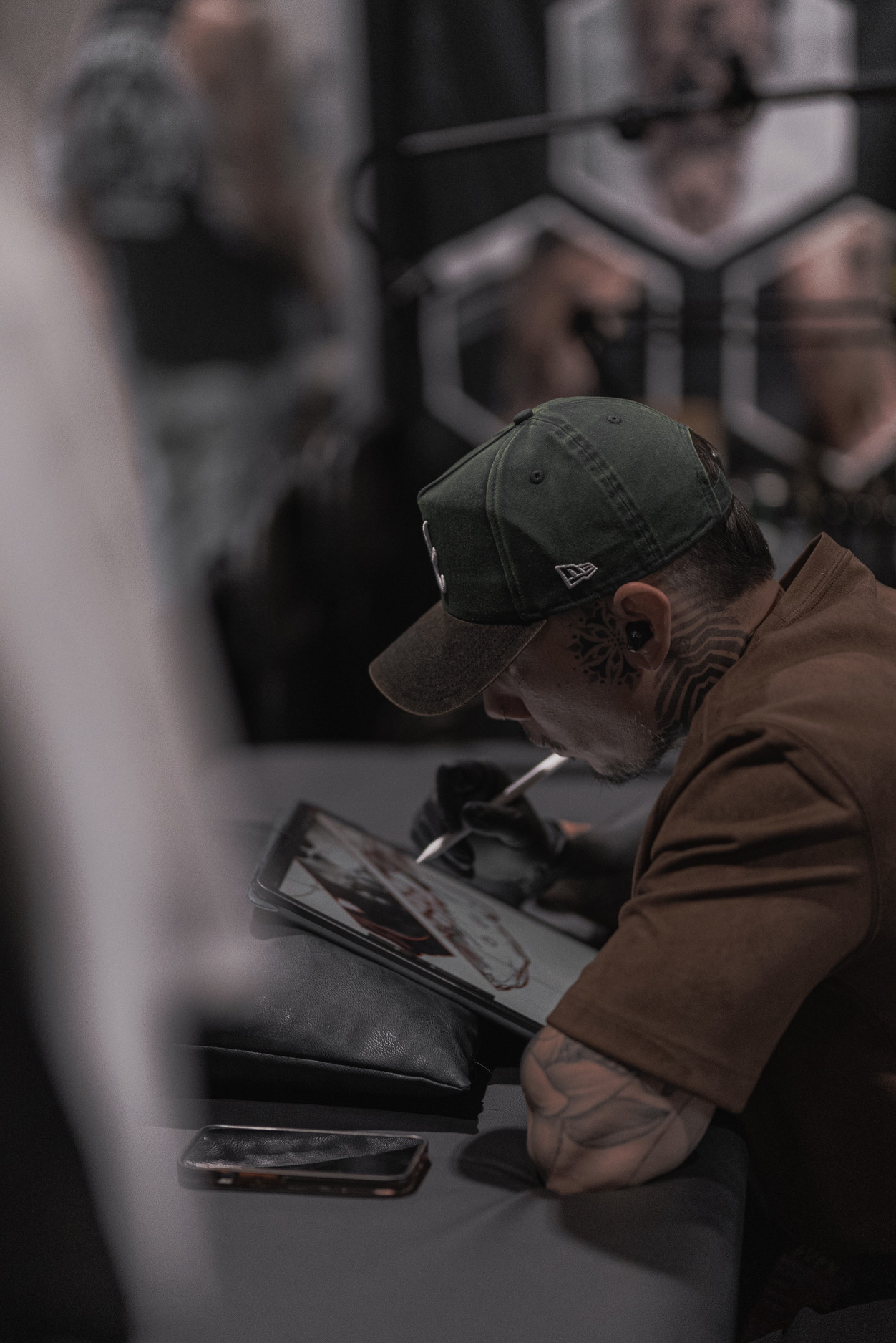 David VanCasso focused at his station, sketching a design